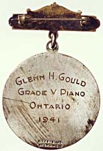 Back of the Toronto Conservatory of Music silver medal, with inscription that reads GLENN H. GOULD, GRADE V PIANO, ONTARIO, 1941