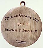 Back of the Toronto Conservatory of Music silver medal, with inscription that reads ORGAN GRADE VIII, 1944, GLENN H. GOULD